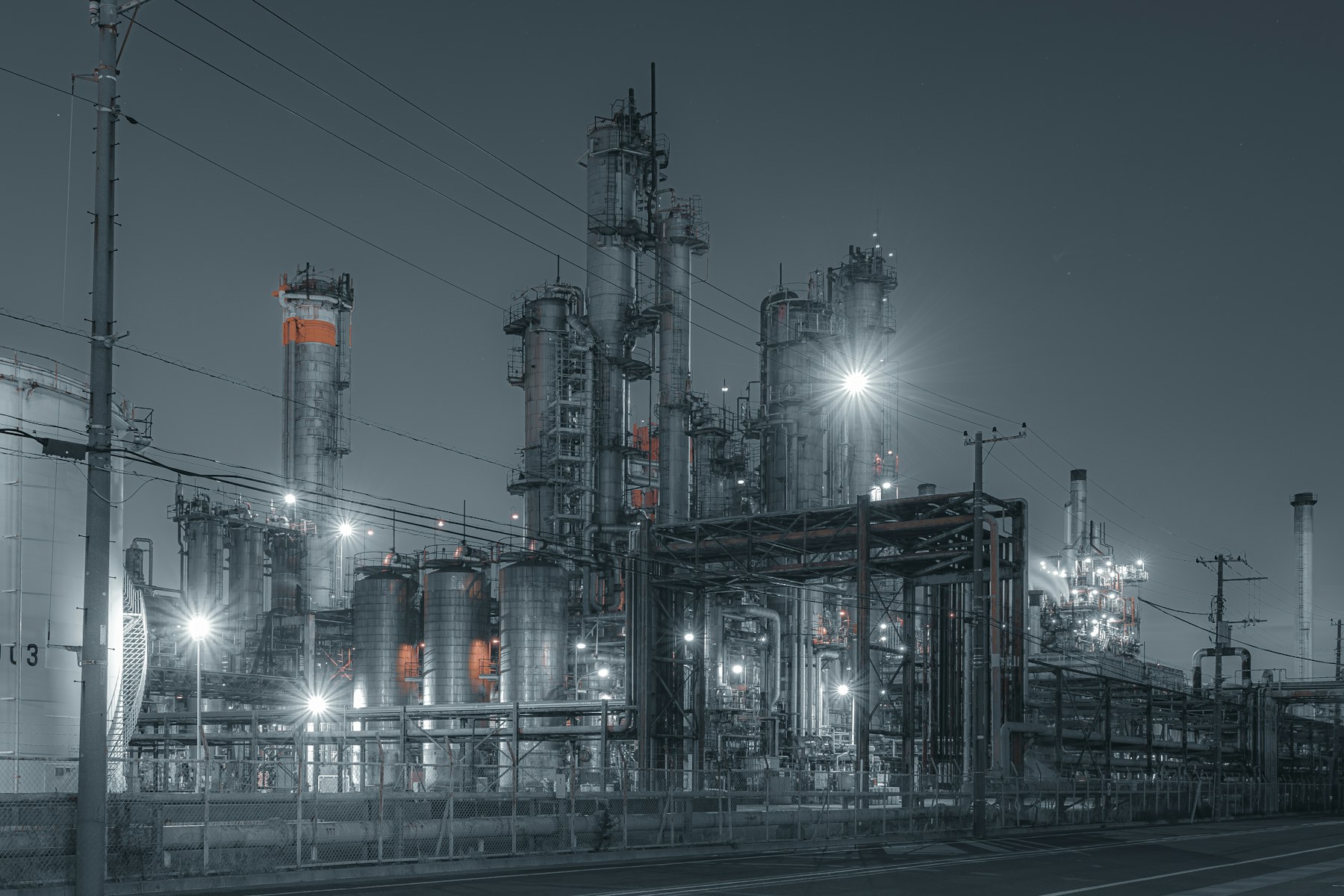 Industrial energy refinery illuminated at night